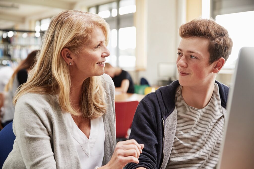 teacher with male student working on computer in c 2024 10 22 11 50 26 utc Large - Important information for parents - ACT Training