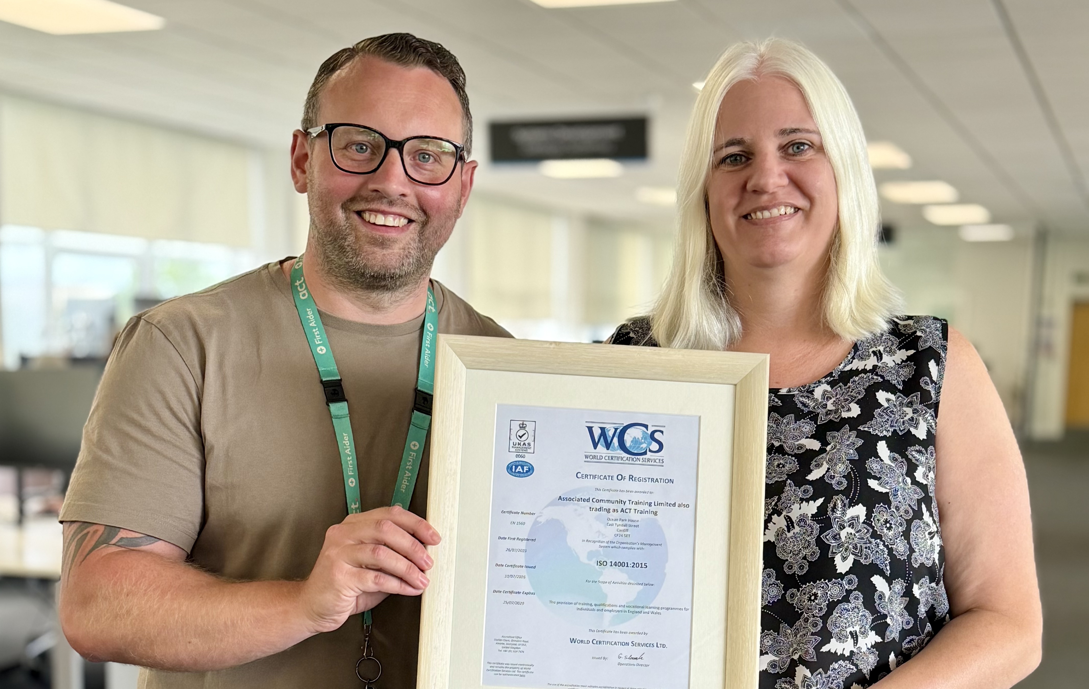 Facilities team members Dean and Emma with the certificate