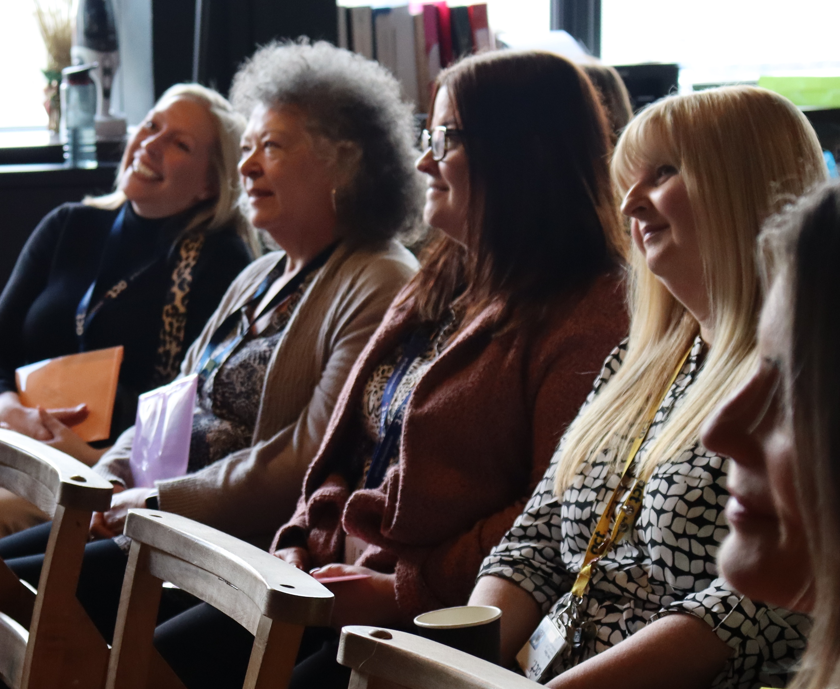 ACT staff members sat listening to talk